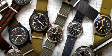 a flatlay of various field watches