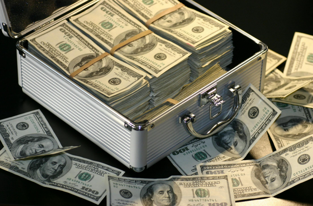 grey metal case of hundred dollar bills
